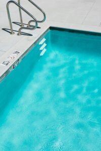 Pool edge with depth marker in feet