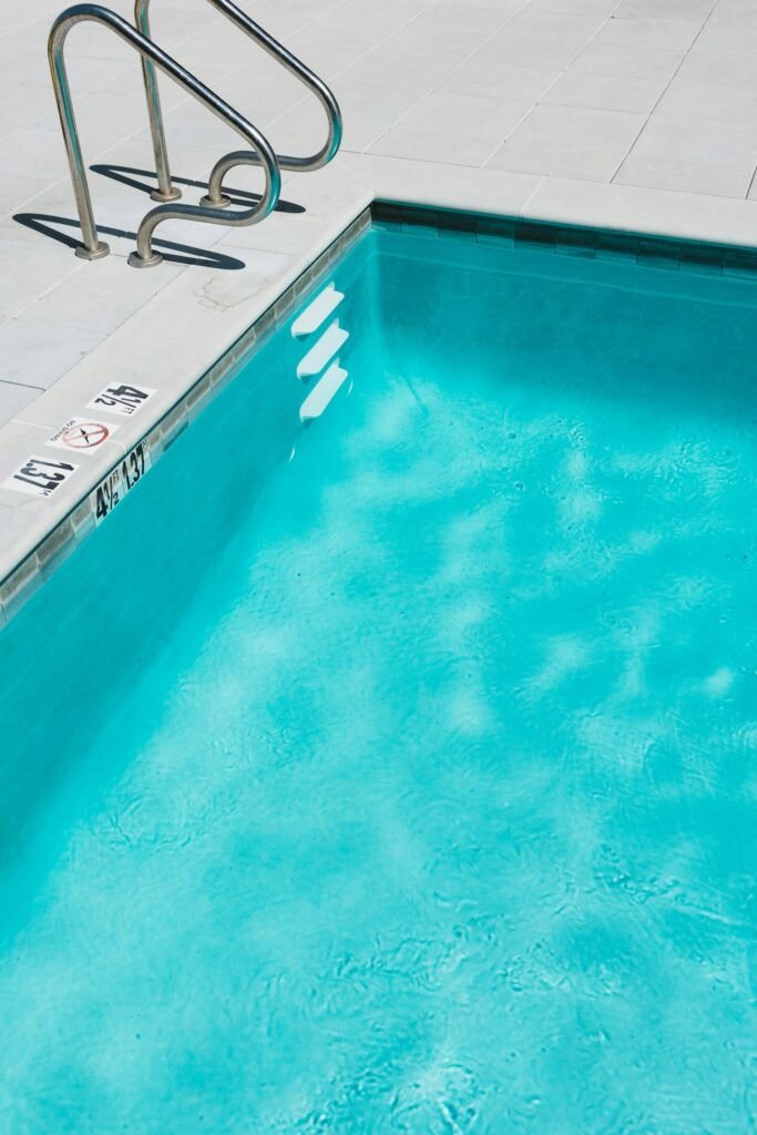 Pool edge with depth marker in feet